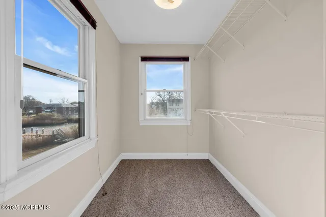 a bedroom with a bed and a closet