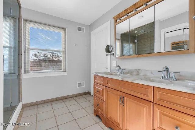 a bedroom with a bed and a view of bedroom