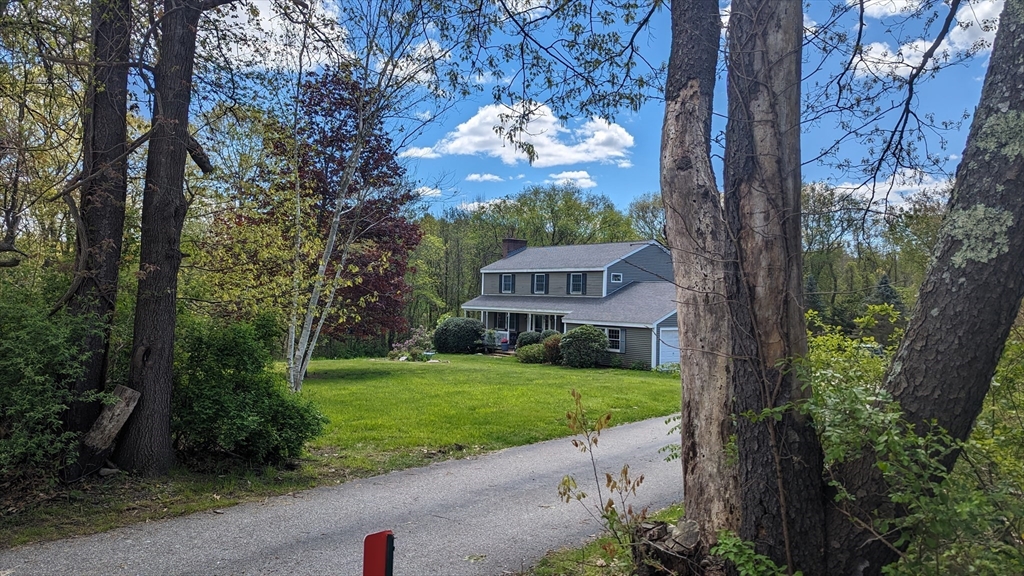 7 Robbins Road Charlton, MA 01507 - Photo 1 of 28 a front view of a house with garden