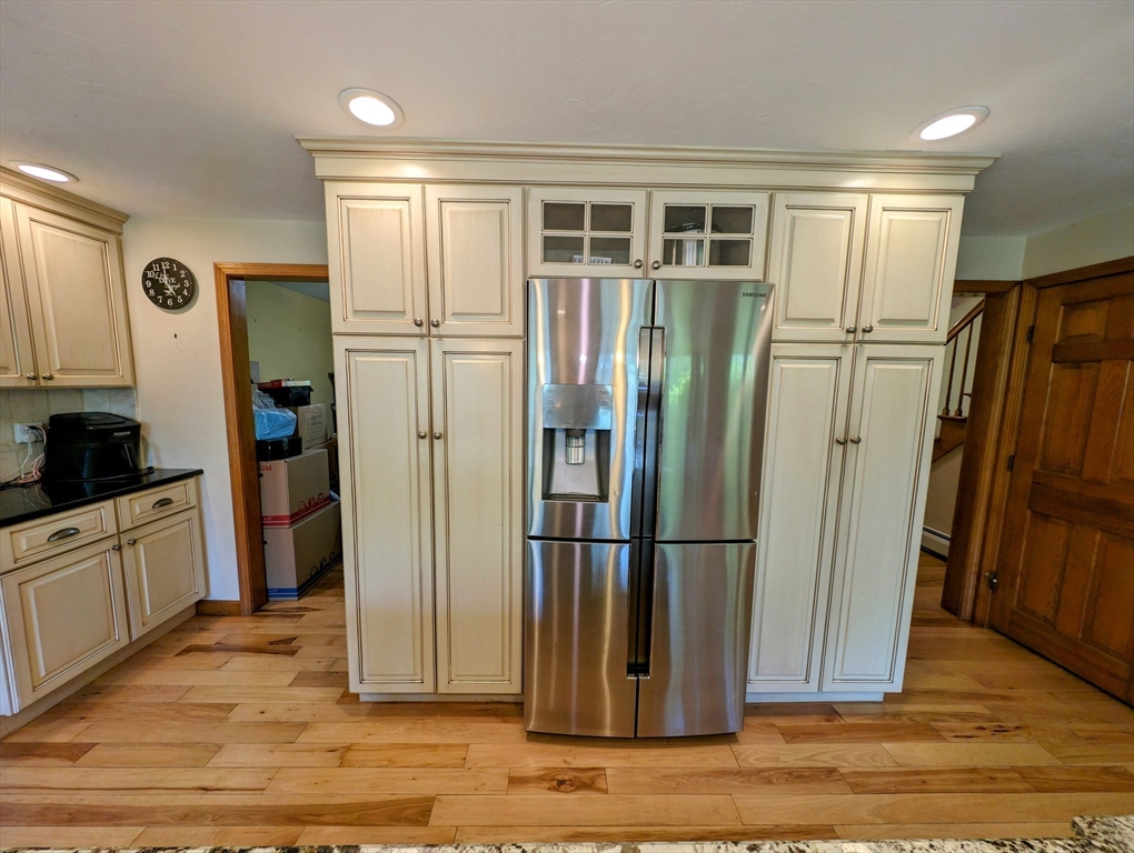 7 Robbins Road Charlton, MA 01507 - Photo 19 of 28 a view of a refrigerator in kitchen and wooden floor
