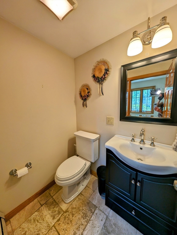 7 Robbins Road Charlton, MA 01507 - Photo 27 of 28 a bathroom with a sink a toilet and mirror