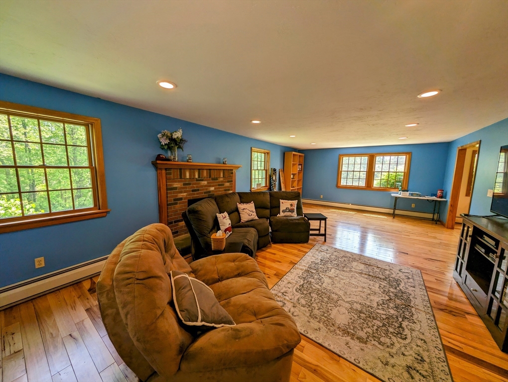 7 Robbins Road Charlton, MA 01507 - Photo 4 of 28 a living room with furniture and a wooden floor