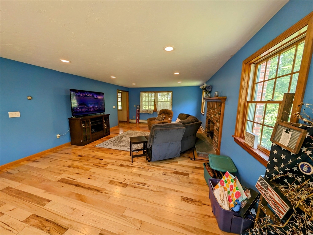 7 Robbins Road Charlton, MA 01507 - Photo 5 of 28 a bed room with furniture and a flat screen tv