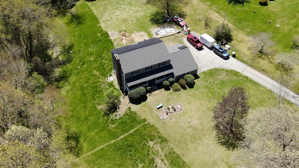 7 Robbins Road Charlton, MA 01507 - Photo 6 of 28 an aerial view of a house with a yard and garden