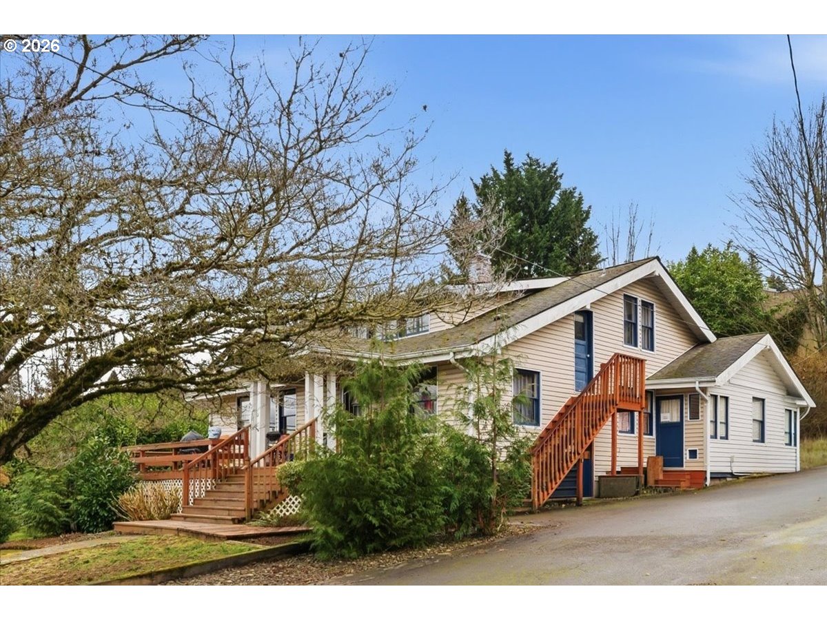 706 West B Street Rainier, OR 97048 - Photo 1 of 47 a front view of a house with a yard