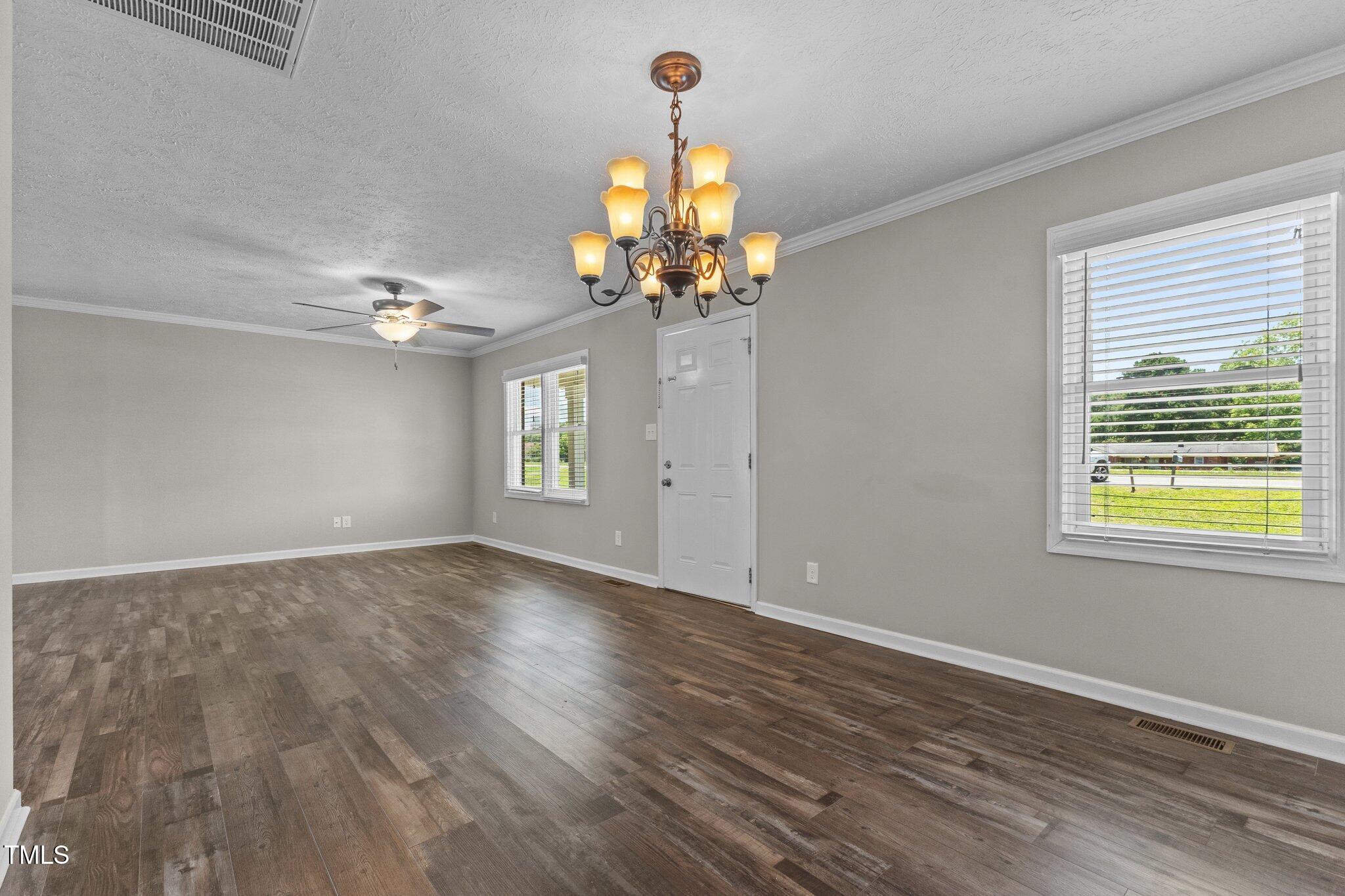 8431 Clinton Road Stedman, NC 28391 - Photo 9 of 24 wooden floor in an empty room with a window