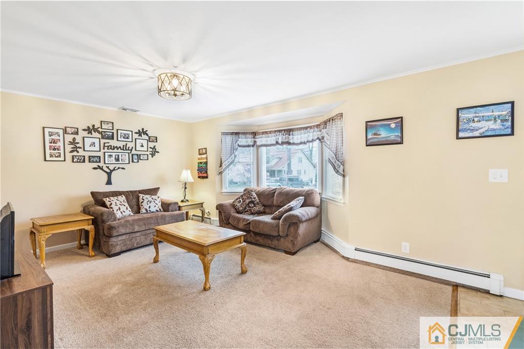 151 East Cliff Road Colonia, NJ 07067 - Photo 7 of 29 a living room with furniture and a window