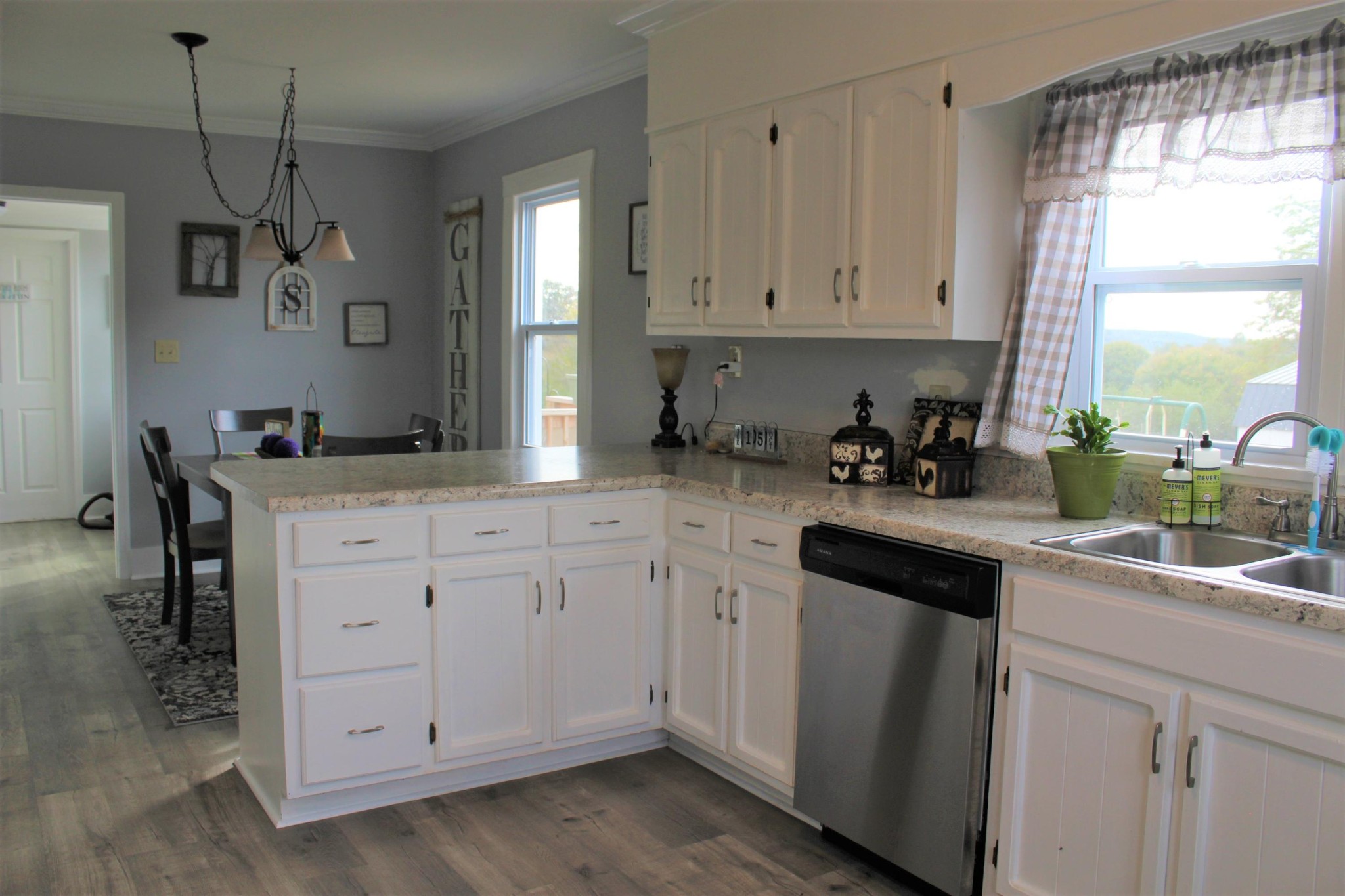 350 Allison Town Road Philadelphia, TN 37846 - Photo 17 of 26 a kitchen with white cabinets and window