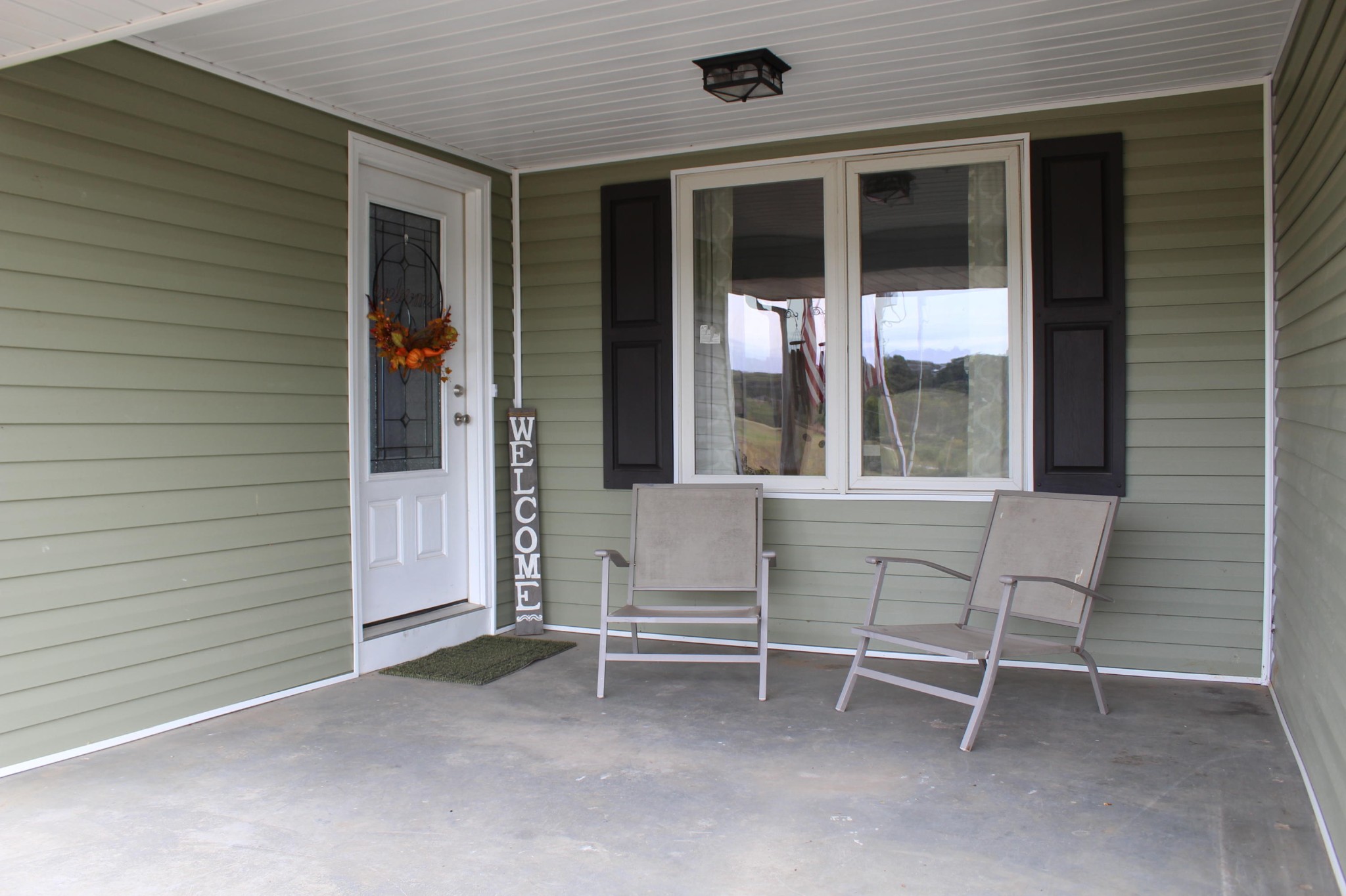 350 Allison Town Road Philadelphia, TN 37846 - Photo 7 of 26 a view of a house with a large window and wooden fence