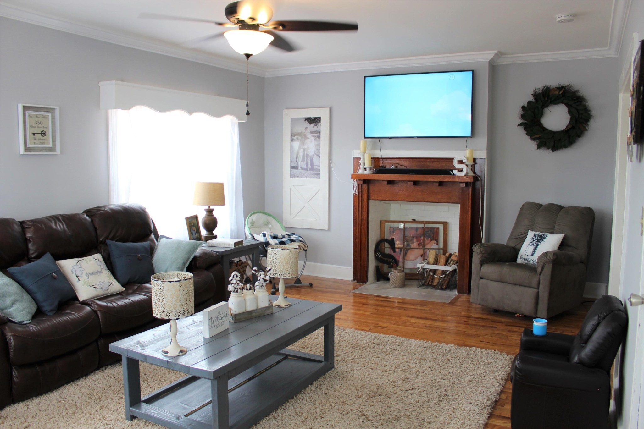 350 Allison Town Road Philadelphia, TN 37846 - Photo 9 of 26 a living room with furniture a fireplace and a flat screen tv