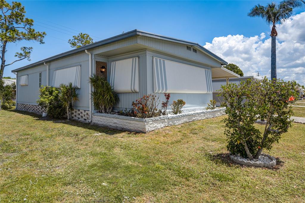 5619 Bayshore Road, Unit 312 Palmetto, FL 34221 - Photo 1 of 40 a front view of a house with garden