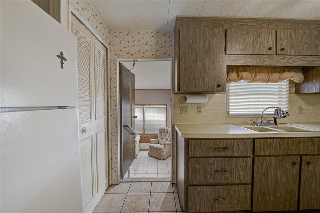 5619 Bayshore Road, Unit 312 Palmetto, FL 34221 - Photo 18 of 40 a kitchen with a sink and cabinets