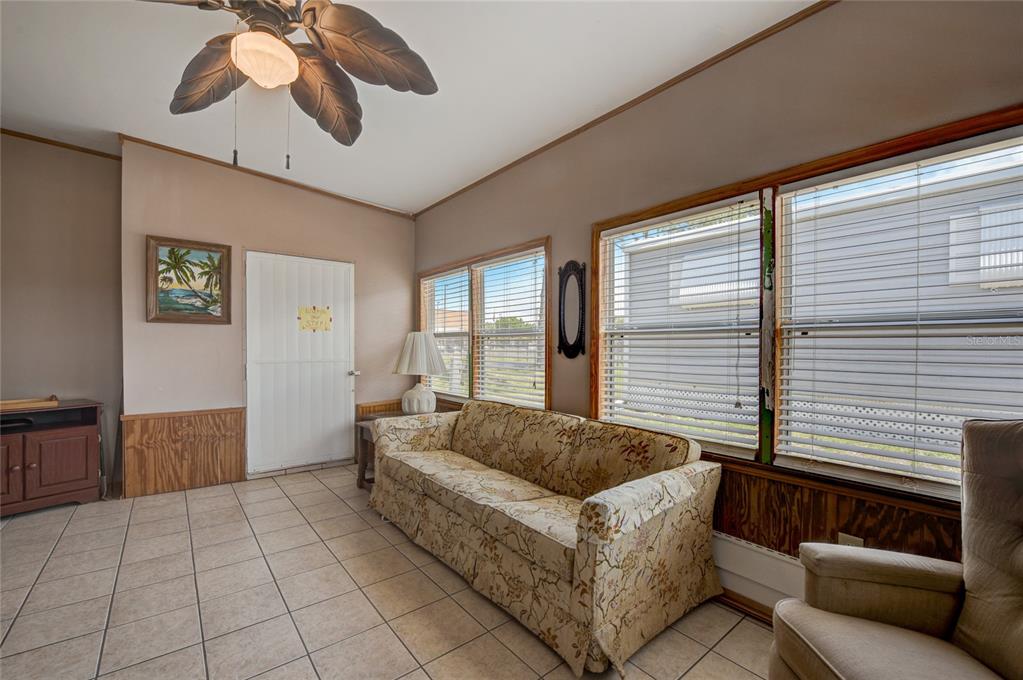 5619 Bayshore Road, Unit 312 Palmetto, FL 34221 - Photo 19 of 40 a living room with furniture and a large window