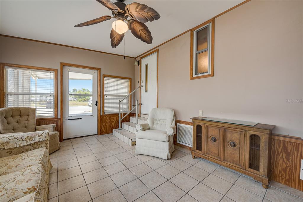 5619 Bayshore Road, Unit 312 Palmetto, FL 34221 - Photo 22 of 40 a living room with furniture and two windows