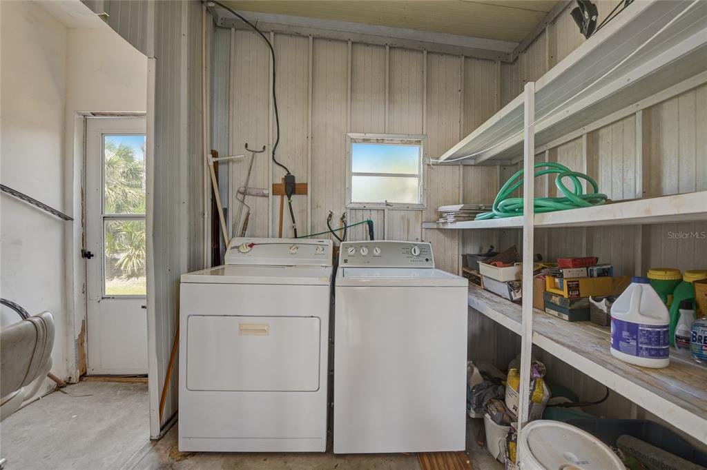 5619 Bayshore Road, Unit 312 Palmetto, FL 34221 - Photo 23 of 40 a utility room with dryer and washer