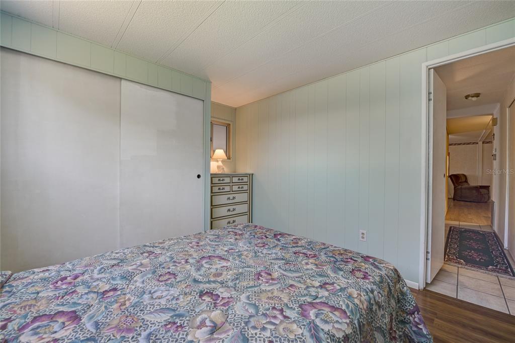 5619 Bayshore Road, Unit 312 Palmetto, FL 34221 - Photo 26 of 40 a bedroom with a bed and walk in closet
