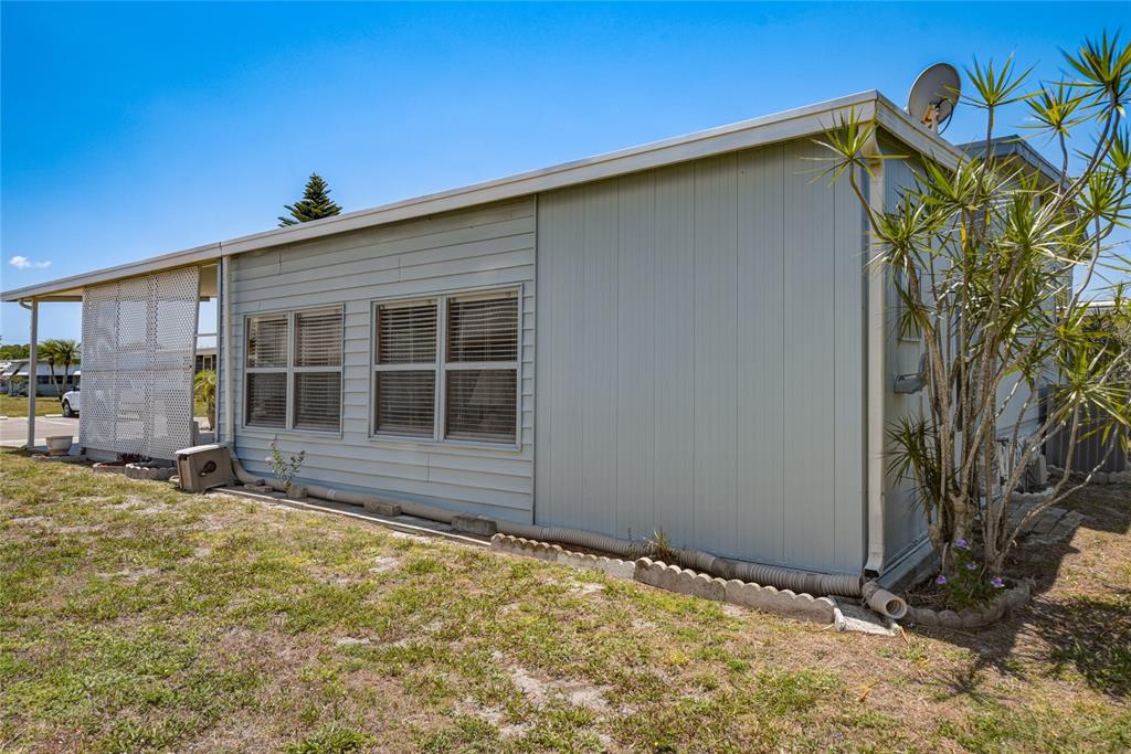 5619 Bayshore Road, Unit 312 Palmetto, FL 34221 - Photo 33 of 40 a view of a house with backyard and sitting area