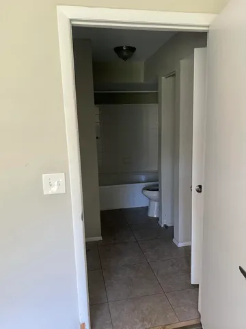 a bathroom with a toilet and a sink