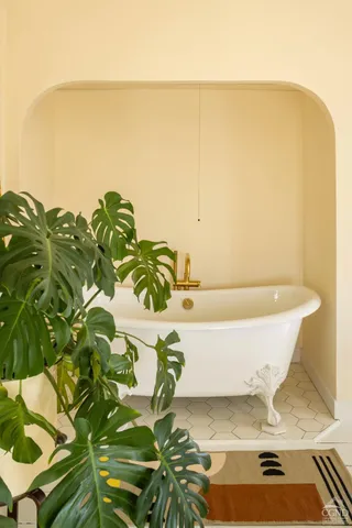 a white bath tub sitting in a bathroom