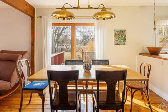 a view of a dining room with furniture window and outside view