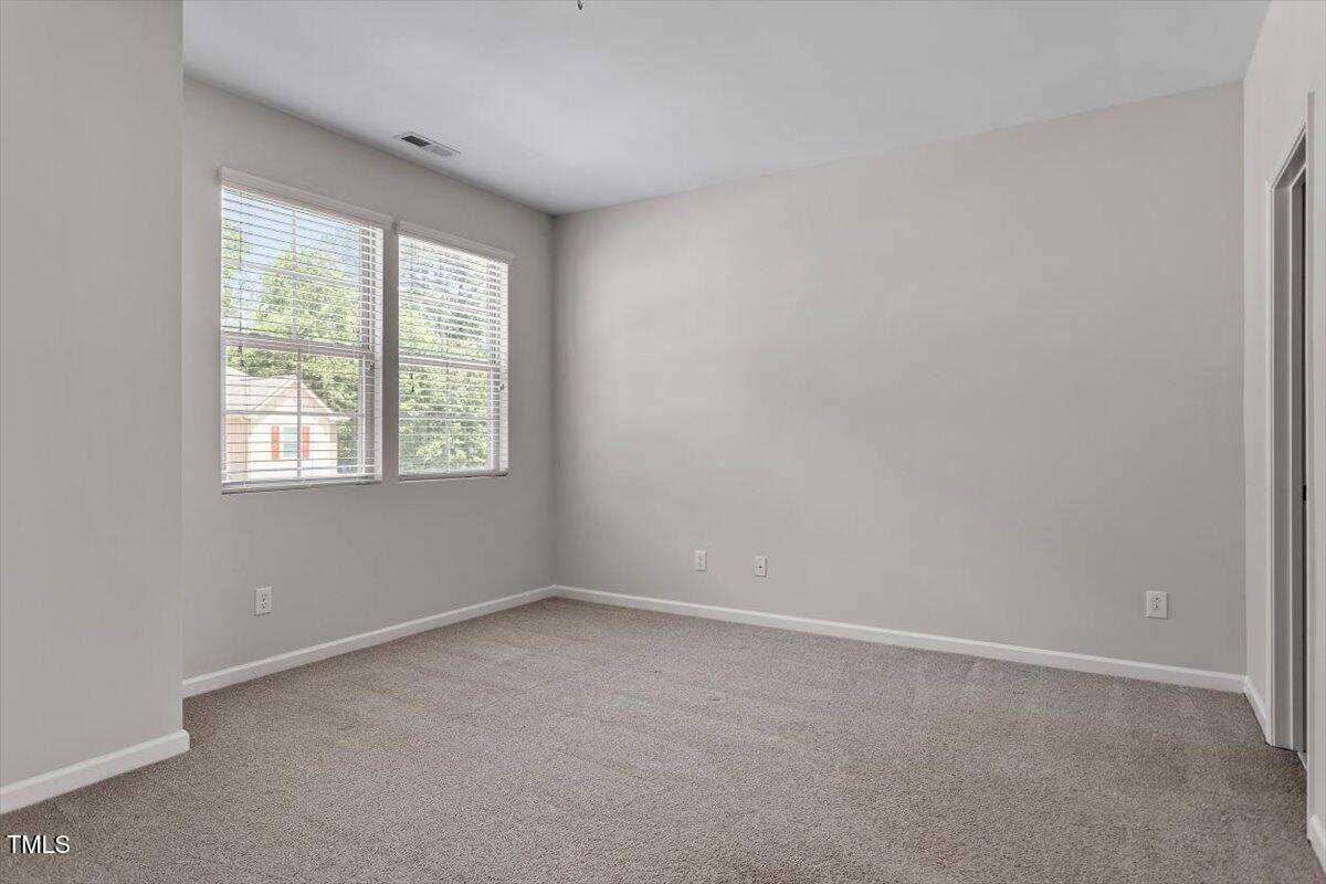 709 Wickham Ridge Road Apex, NC 27539 - Photo 22 of 36 an empty room with a window