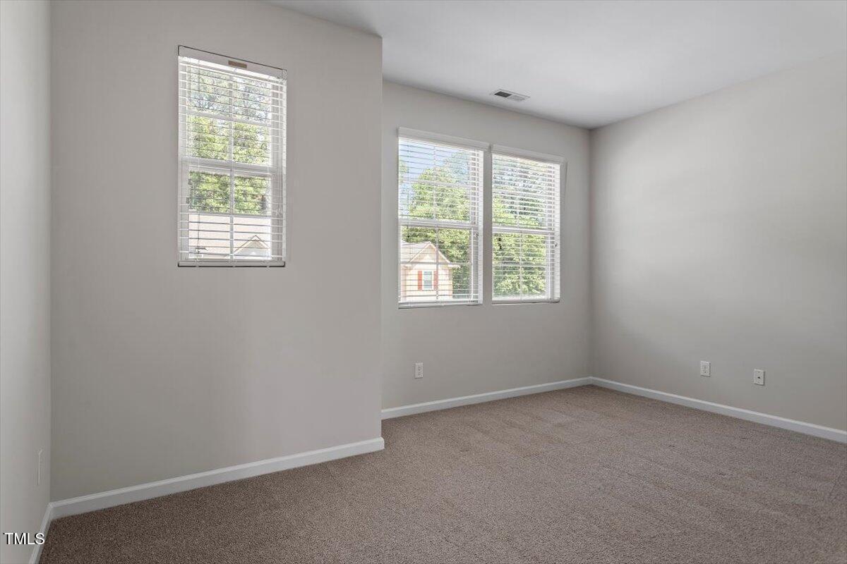 709 Wickham Ridge Road Apex, NC 27539 - Photo 23 of 36 an empty room with a window