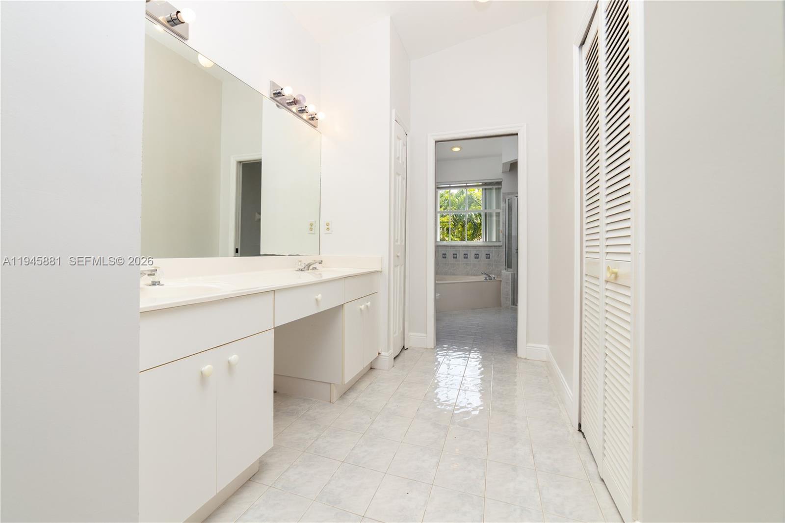11504 Southwest 152nd Court Miami, FL 33196 - Photo 11 of 17 a bathroom with a sink and a mirror