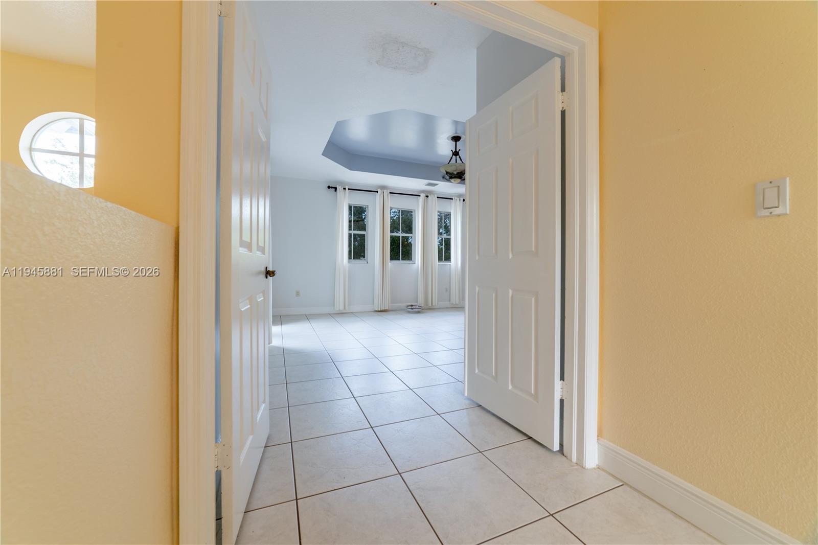 11504 Southwest 152nd Court Miami, FL 33196 - Photo 13 of 17 a view of a hallway with wooden shelves