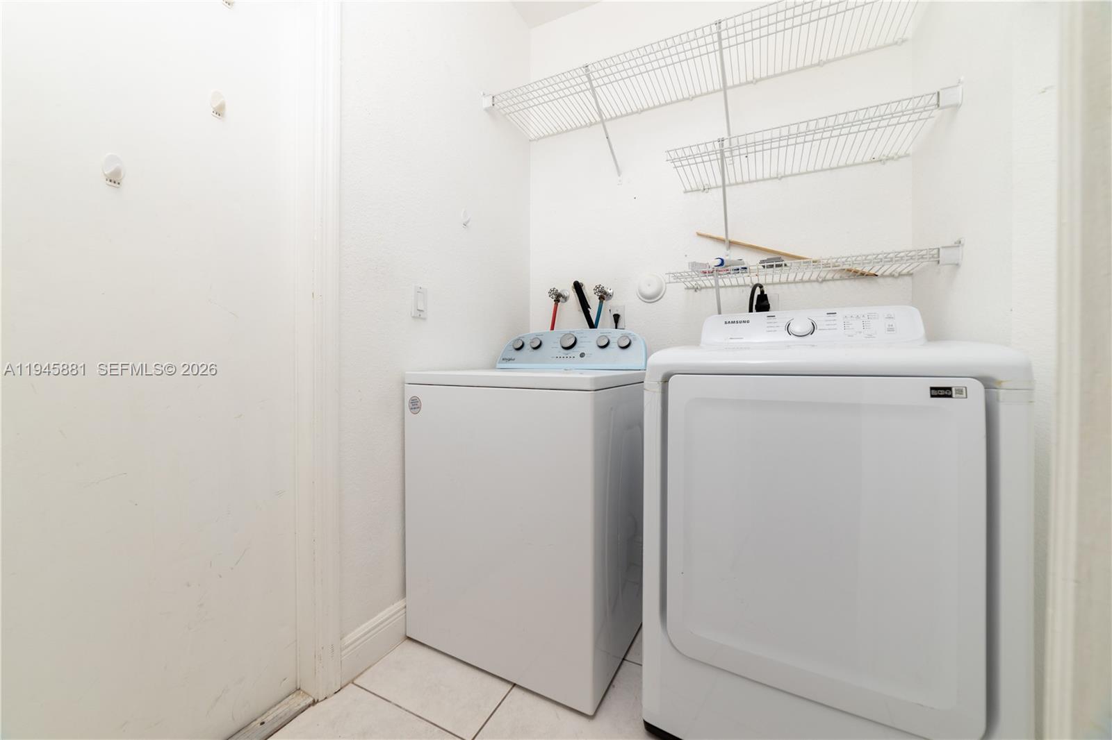 11504 Southwest 152nd Court Miami, FL 33196 - Photo 17 of 17 a utility room with dryer and washer