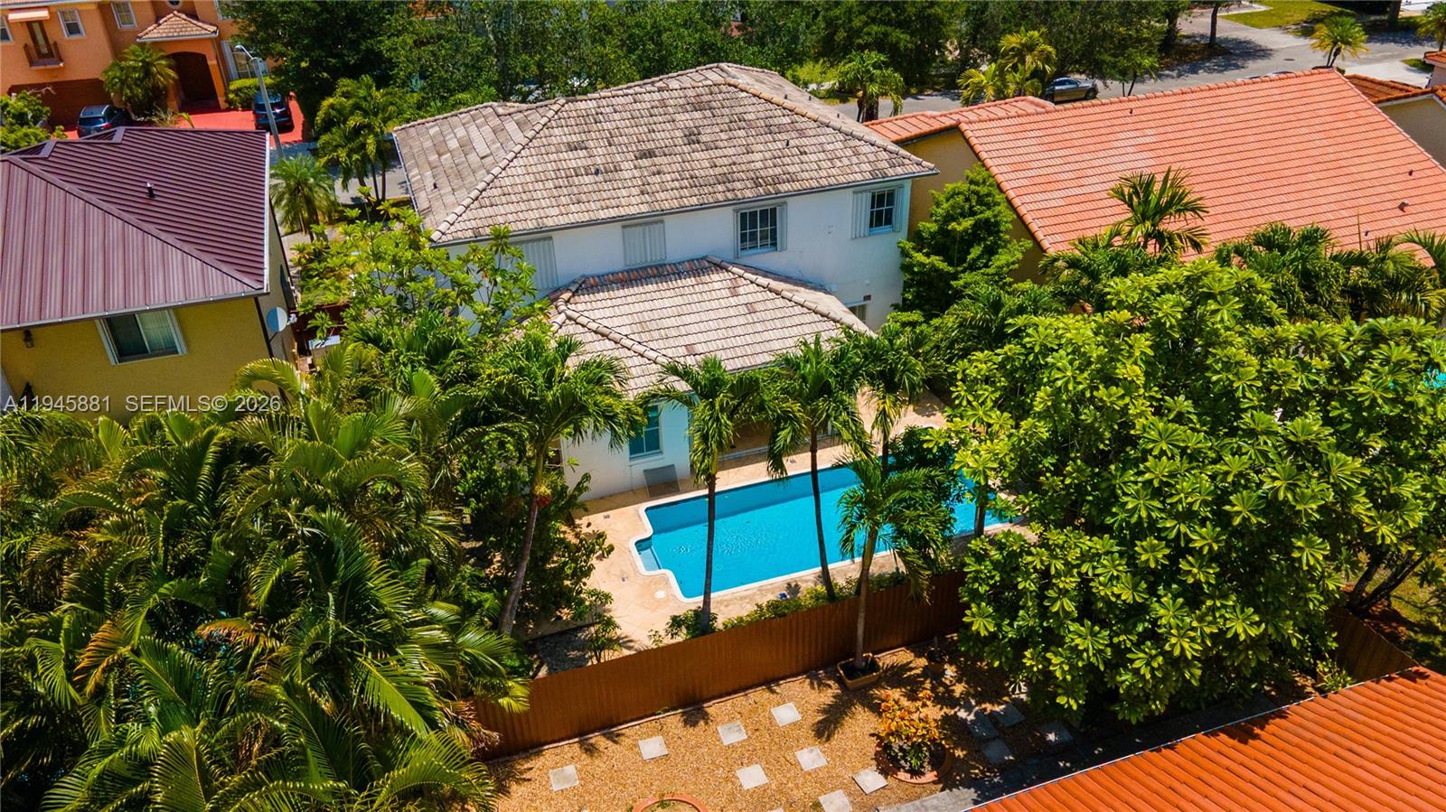 11504 Southwest 152nd Court Miami, FL 33196 - Photo 5 of 17 an aerial view of a house with a yard and potted plants