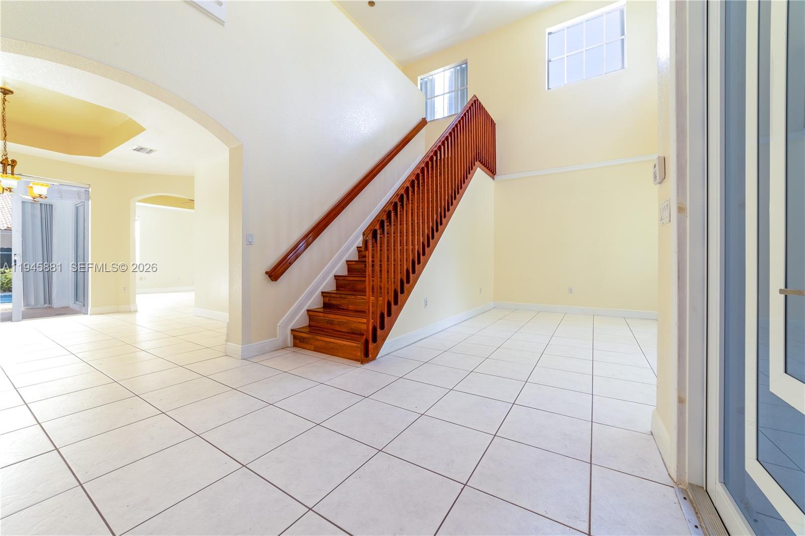 11504 Southwest 152nd Court Miami, FL 33196 - Photo 8 of 17 a view of an entryway with wooden floor