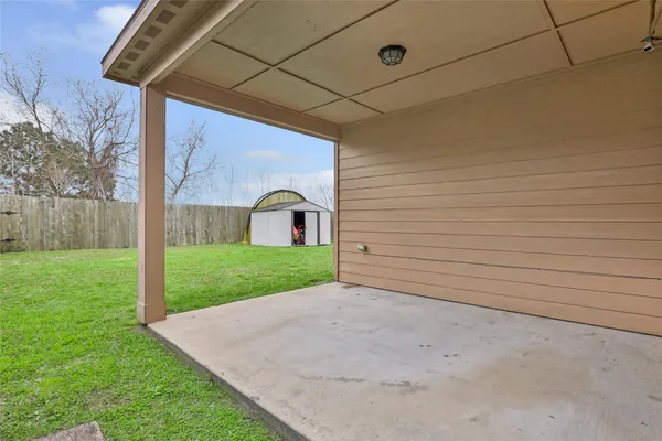 a view of a back yard of the house
