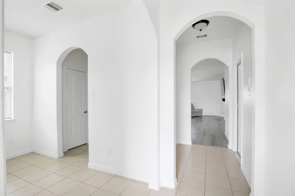 a view of a bathroom with windows and sink