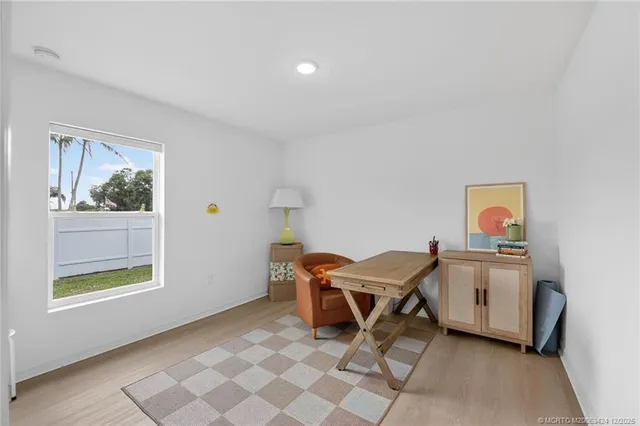 a living room with a table and a window
