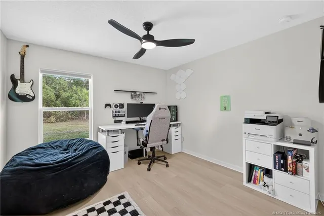 a bedroom with a bed and a book shelf