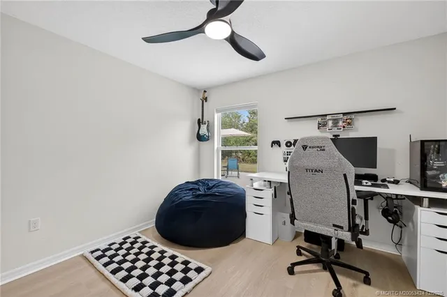 a bedroom with a workspace