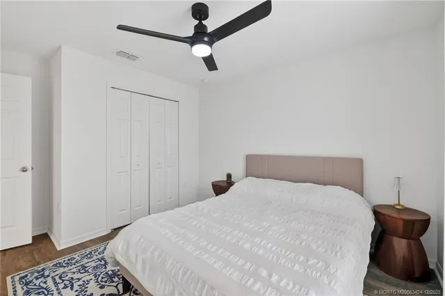 a bedroom with a bed and a chair