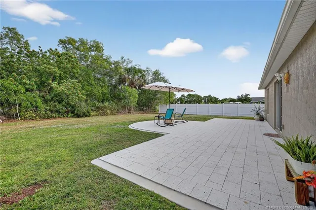 a view of a swimming pool and trees in the background