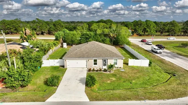a view of a swimming pool with a yard