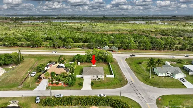 a view of a swimming pool with a yard