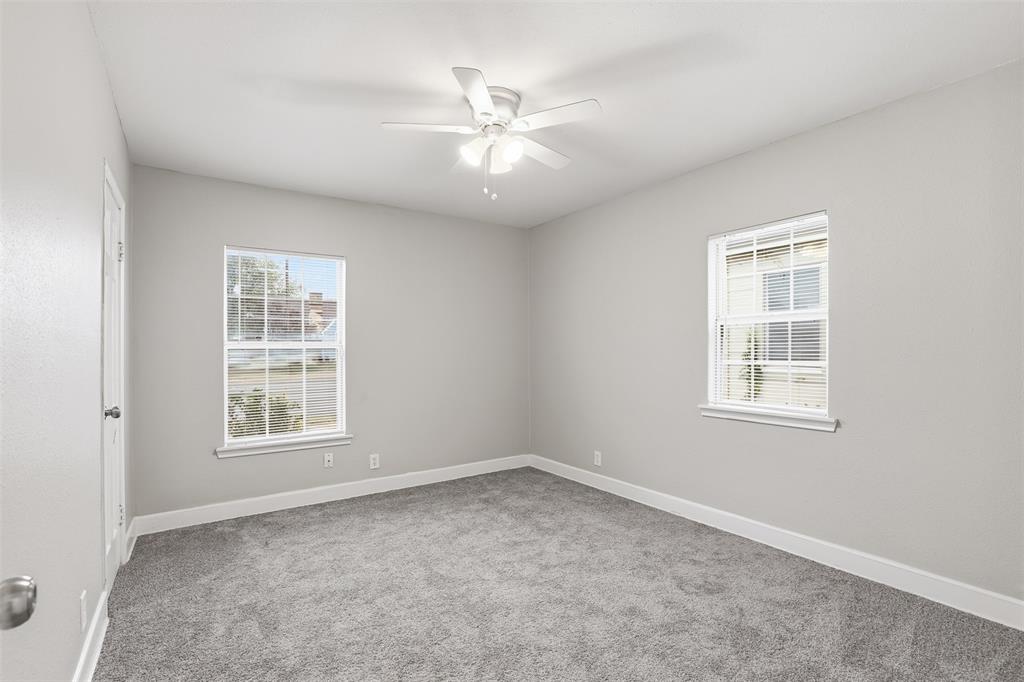 227 South Hampton Road Dallas, TX 75208 - Photo 13 of 32 Empty room featuring light colored carpet and a ceiling fan