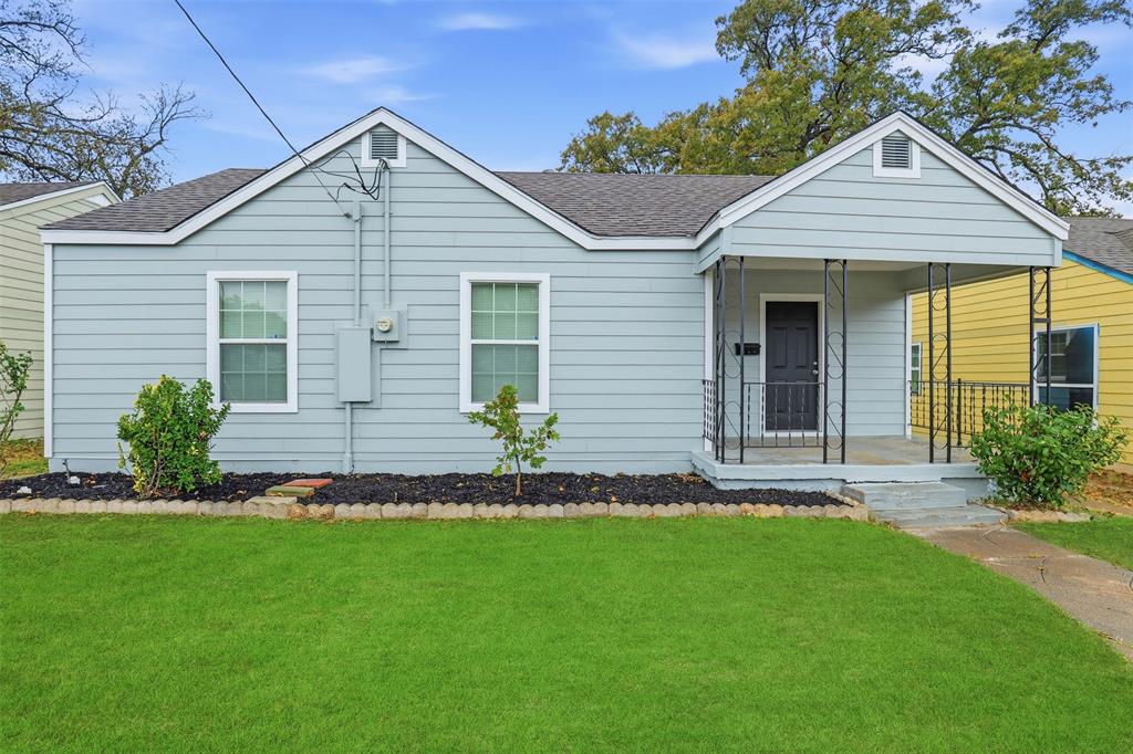 227 South Hampton Road Dallas, TX 75208 - Photo 2 of 32 View of front of house featuring a porch, a front lawn, and a shingled roof