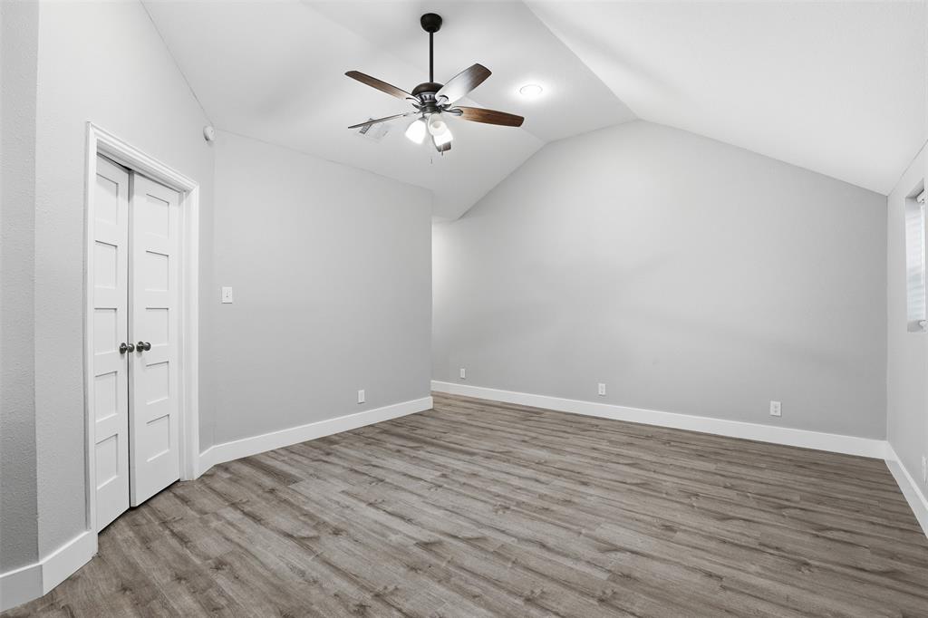 227 South Hampton Road Dallas, TX 75208 - Photo 26 of 32 Bonus room with a ceiling fan, wood finished floors, and lofted ceiling