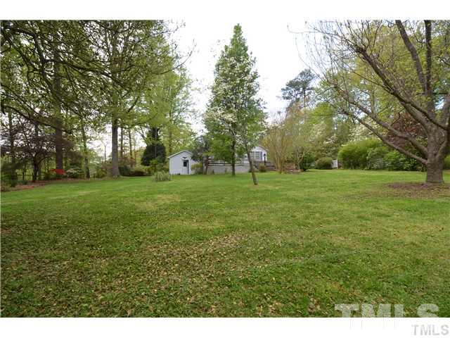 7000 Leesville Road Raleigh, NC 27613 - Photo 1 of 24 a view of a grassy field with trees