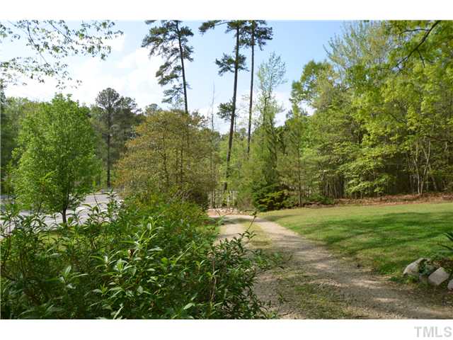 7000 Leesville Road Raleigh, NC 27613 - Photo 18 of 24 a backyard of a house with lots of green space