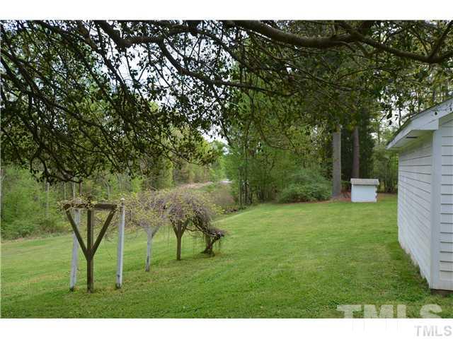 7000 Leesville Road Raleigh, NC 27613 - Photo 8 of 24 a view of backyard with a barn