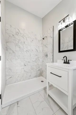 a bathroom with a sink a bathtub and a shower