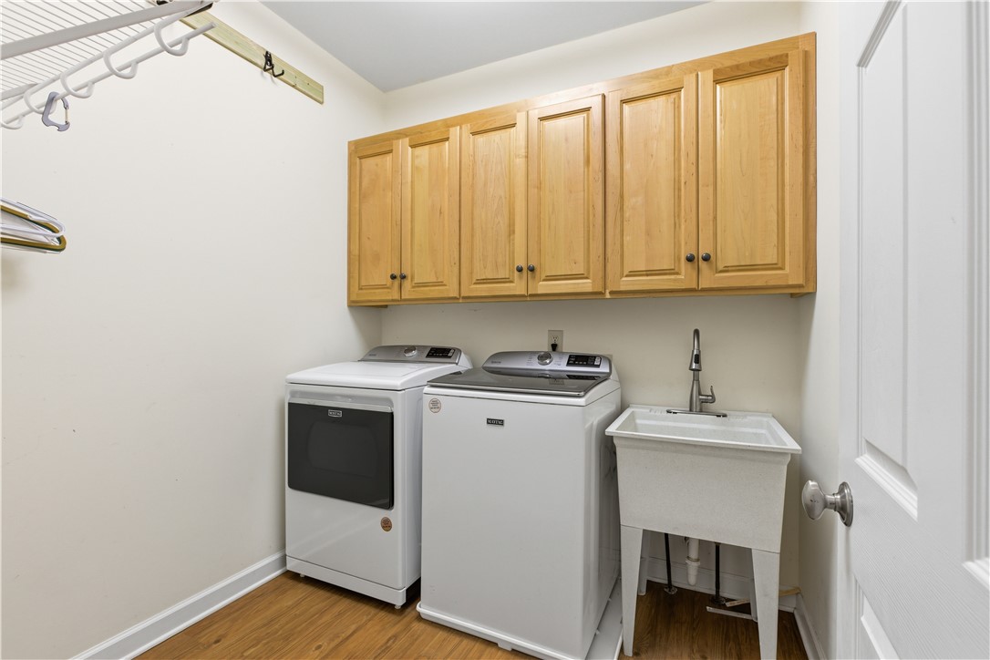 501 Capri Point Lavonia, GA 30553 - Photo 35 of 50 This laundry room features ample cabinetry and a functional utility sink.