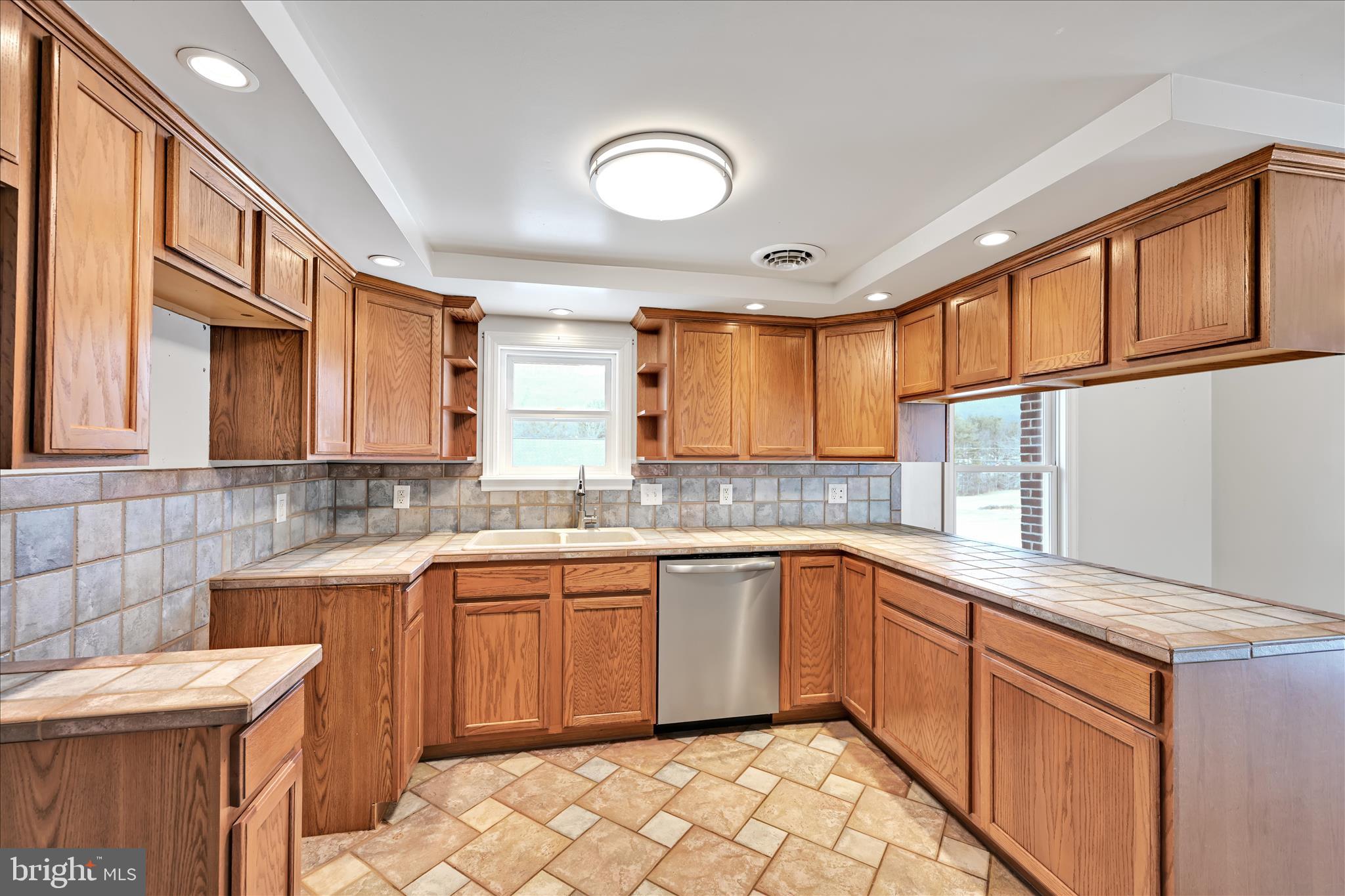 424 Fearnot Road Sacramento, PA 17968 - Photo 11 of 44 a kitchen with a sink stove and cabinets