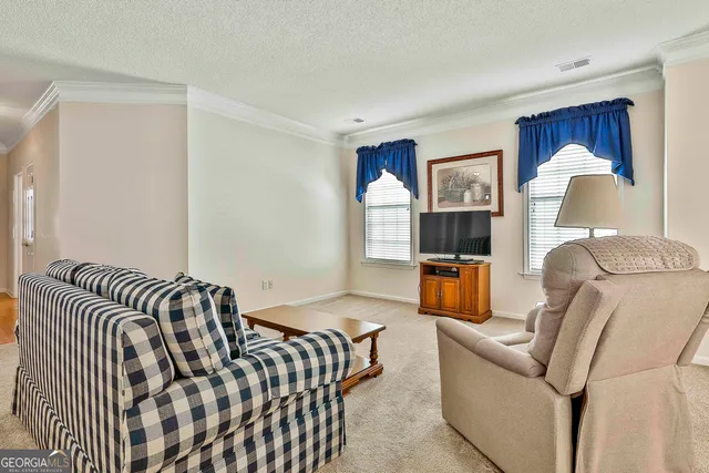 a bedroom with furniture and wooden floor